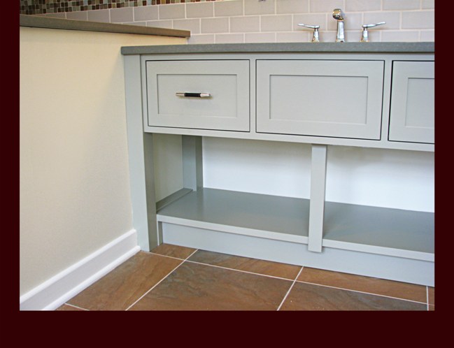 Vanity flat panel drawer front, end post, and lower shelf detail.