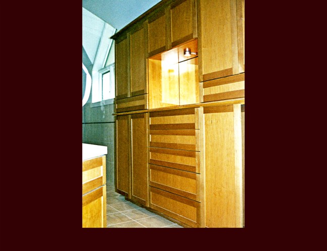 Maple Master Bath Cabinet. Flat Panel door style. Cove Crown Moulding. Shellaced and finished.