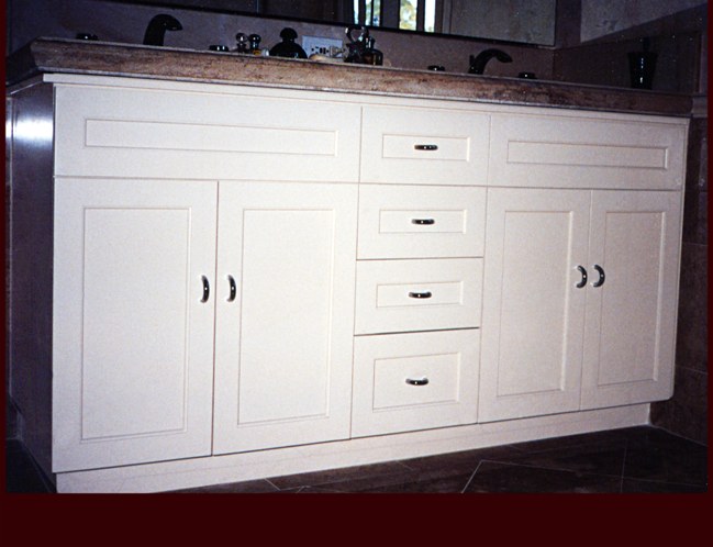 White Painted Double Sink Vanity Cabinet. Flat Panel Full Overlay door style.