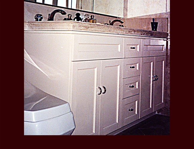 White Painted Double Sink Vanity Cabinet. Flat Panel Full Overlay door style.