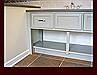 Vanity flat panel drawer front, end post, and lower shelf detail.