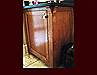 White Oak Vanity. Flat Panel Inset door style. Ebony inlays in doors. Post detail with corbels. Decorative end panel.