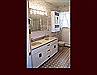 Refinished Double Sink Vanity Cabinet and Storage Cabinet over toilet.