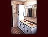 Refinished Double Sink Vanity Cabinet with full height linen cabinet.