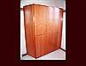 Cherry Master Bath Cabinet. Modern Flat Slab door style. Hamper and linen and wardrobe storage. Adjustable shelving.
