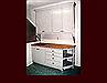 Painted Storage/Craft Cabinetry. Flat Panel Inset door style. Crown Moulding. Open corner shelving.