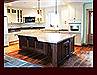 Custom Stained Walnut Kitchen Island. Flat Panel full overlay door style.