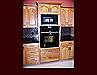 Custom Oak Kitchen Remodel. Raised Panel Cathedral door style. Full height wall oven cabinet with full extension pots & pans drawers and upper storage. Crown Molding.
